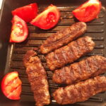 Közlenmiş Patlıcan Yatağında Beyti Kebap tarifi